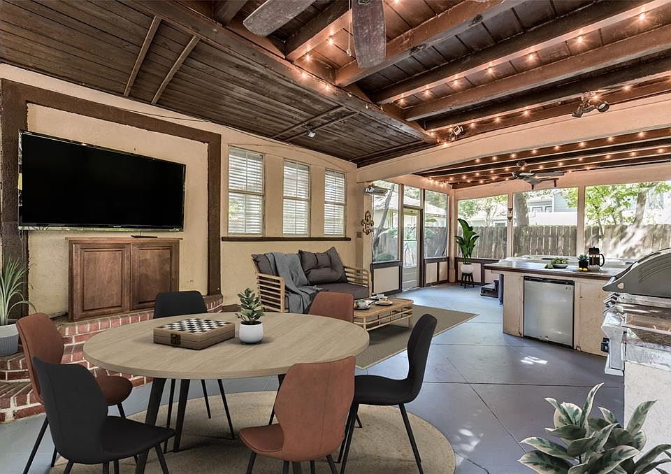 The approx 30x15 (Buyer to verify) screened in patio room is the ultimate in entertainment. Featuring outdoor Kitchen, wall mounted TV, hot tub/spa (included), and space for seating and dining areas. You can enter this room from both front and back d