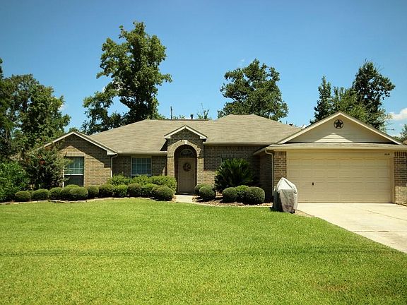 Nice large front yard with attached 2 car garage.