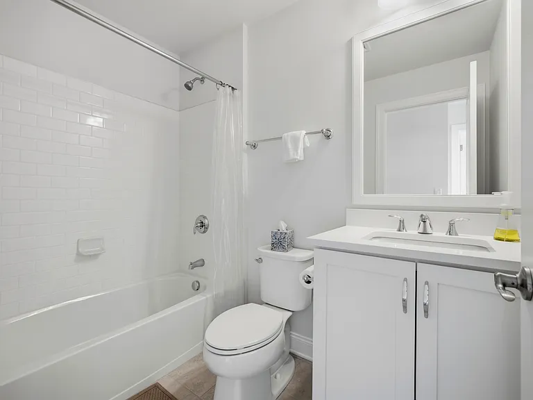 Bedroom 2 & 3 share hall bathroom with quartz vanity.