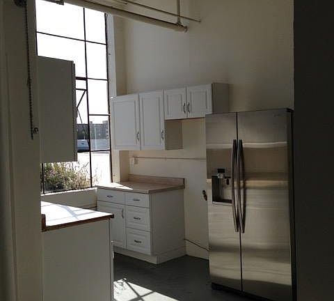 Full Kitchen with Gas Stove and Fridge