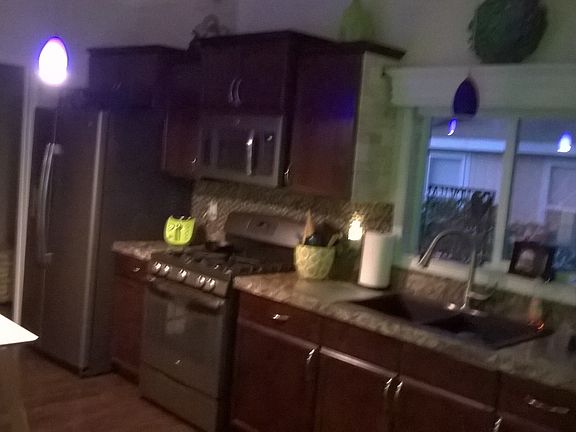 wood cabinets/ bronze appli