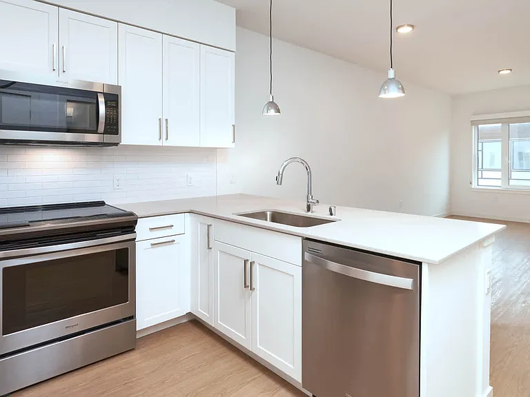 Kitchen with Quartz Countertops and Stainless Steel Appliances
