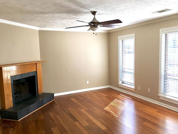 Living room w/fireplace and fan