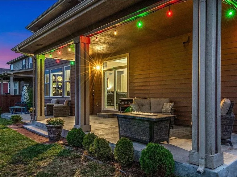 Back of home with covered patio