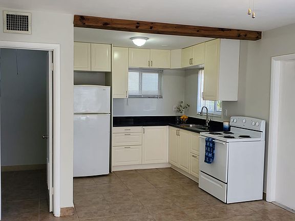 Bright and well lit kitchen and storage