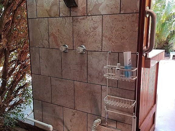 Outside shower next to patio