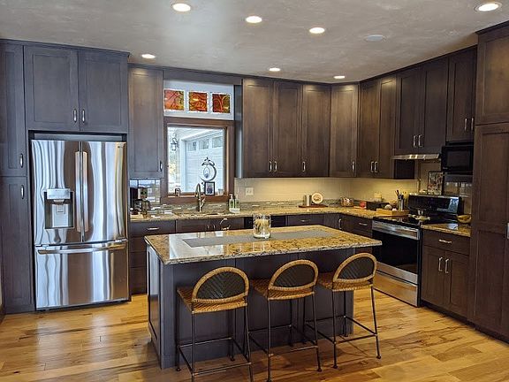 Kitchen with large island quartz counter tops