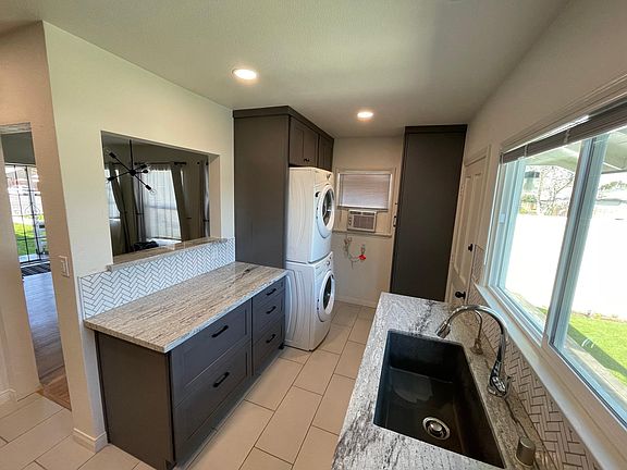 kitchen and laundry with washer and dryer