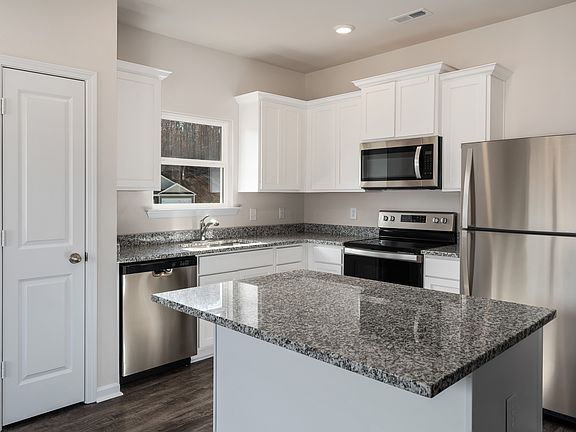 Gorgeous, upgraded kitchen with an island and stainless steel appliances