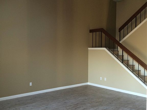 Living Room Facing Stairs from Dining
