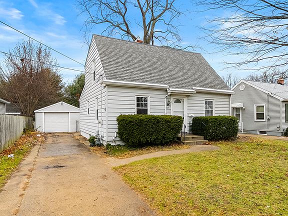 Spacious front of the home with plenty of parking _ comfortably fits 4+ cars and adds convenience for guests