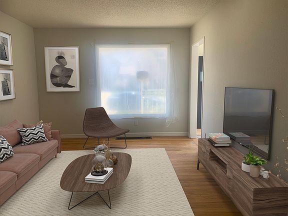 Living Room shown with furniture. Hardwood floors on main level.