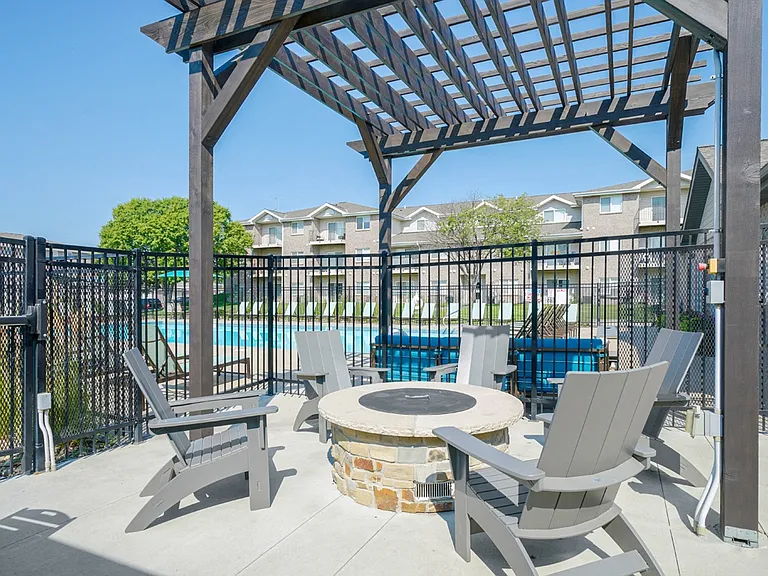 Our updated poolside lounge space with firepit is perfect for gathering with friends on those chilly nights.