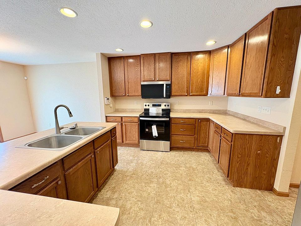 Spacious open concept living area with updated kitchen appliances
