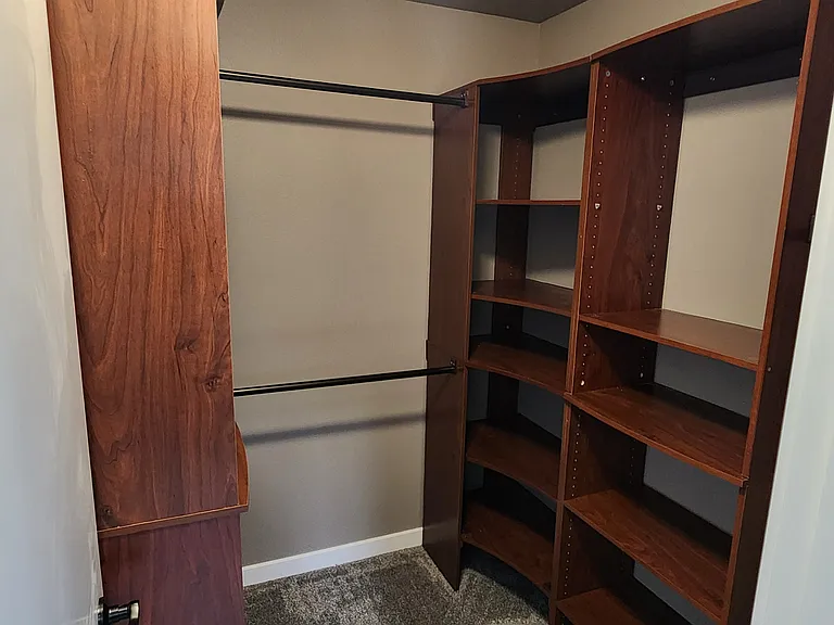 Master Bedroom walkin closet with built in shelving.