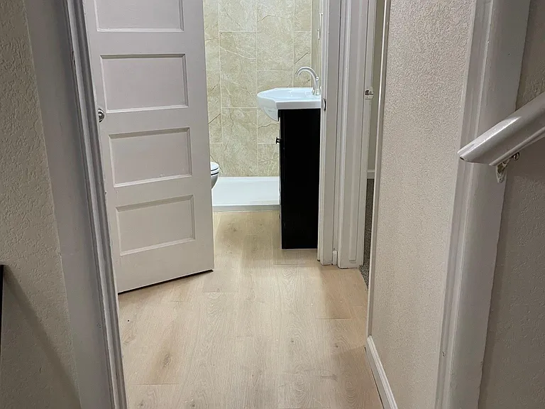 HALL LEADING TO BATHROOM