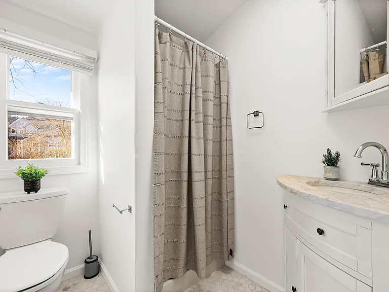 Second floor full bathroom with stall shower.