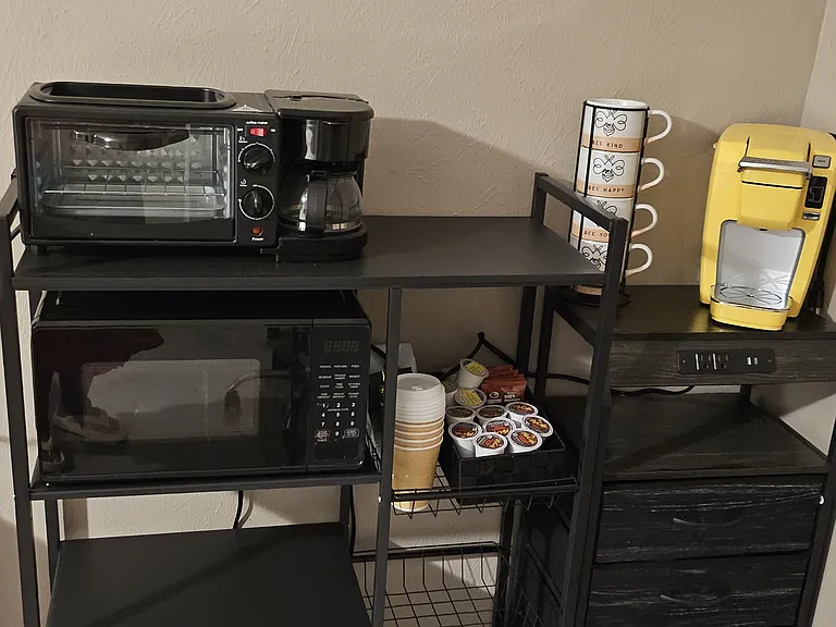 Cook station with small appliances and coffee station.