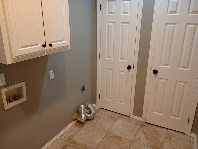 Laundry room with Pantry/Storage.