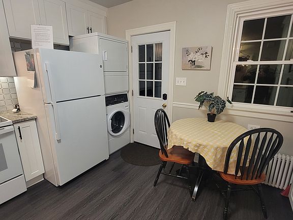 Full size Washer/dryer stack pack. Back door leading to deck and yard with privacy fence.