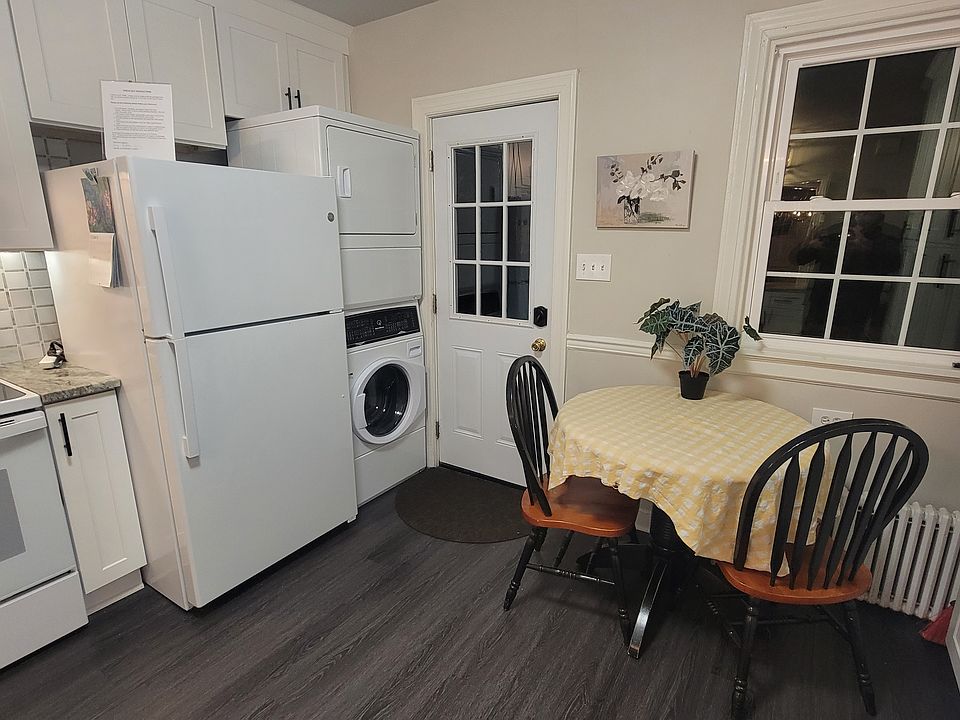 Full size Washer/dryer stack pack. Back door leading to deck and yard with privacy fence.