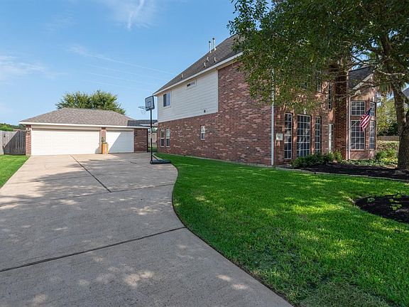 The spacious drive leads to a large detached 3 car garage.