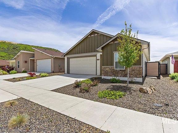 Front view of the home and Avimor Hills from Old Ranch Street, featuring low-maintenance, drip-irrigated landscaping