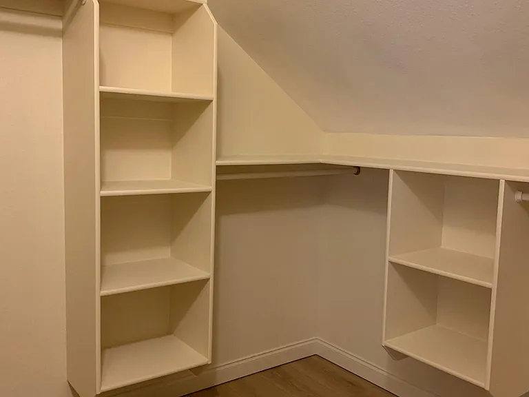 Primary bedroom walk-in closet.
