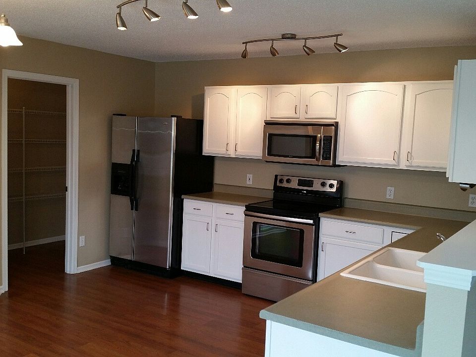 Kitchen and view into pantry and laundry