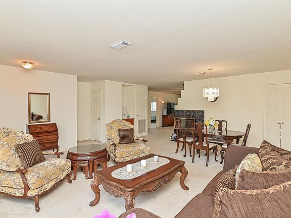Another view of the large formal living room and dining area with lots of natural light.