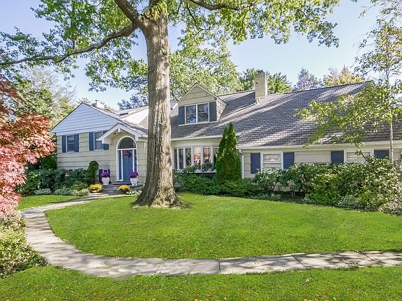 Prime Location! 5 BR, 4 1/2 Bath Quaker Ridge Treasure set on .46 acres of private property