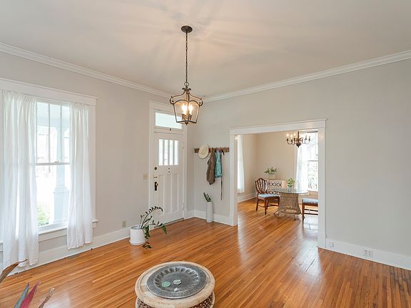 living room, facing dining room and front entry