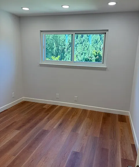 Upper level bedroom #2 with window to backyard.