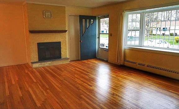 Living room with wood burni...