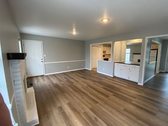 Dry bar in living room. Door leads to central stairwell and basement garage. All new insulated doors for quiet living.