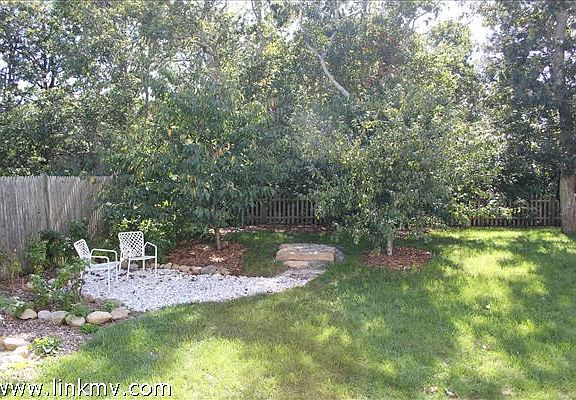 Side Yard with fruit trees and sitting area