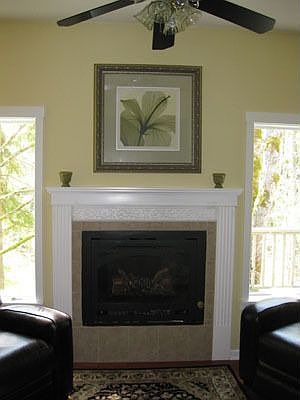 Propane firepalce in master suite flanked by leather recliners.