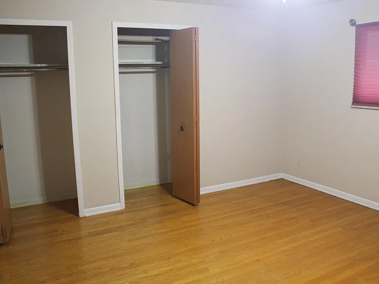 Bedroom 1 with his and her closet.