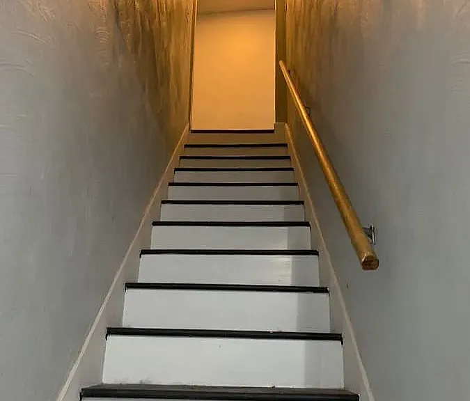 Stairway to basement Bedroom and office/bonus room