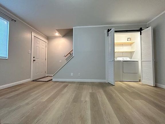 Living room with newly added laundry closet