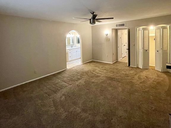 Primary bedroom with small doible door closet
