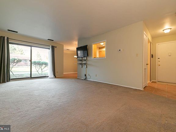 Spacious living room that looks out onto patio
