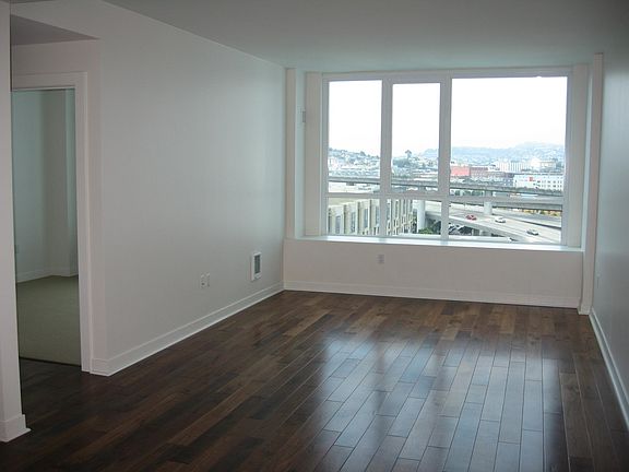 Living room and entry to bedroom.