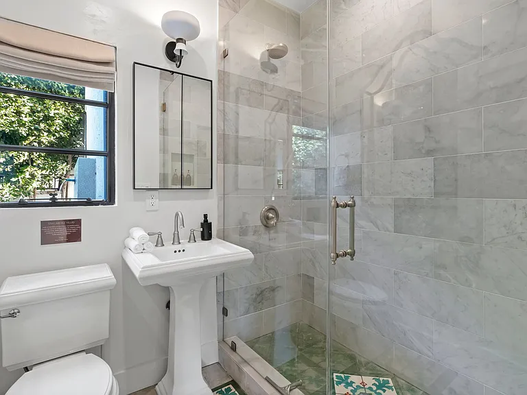 Step into a spa-like shower stocked with premium toiletries and plush towels.