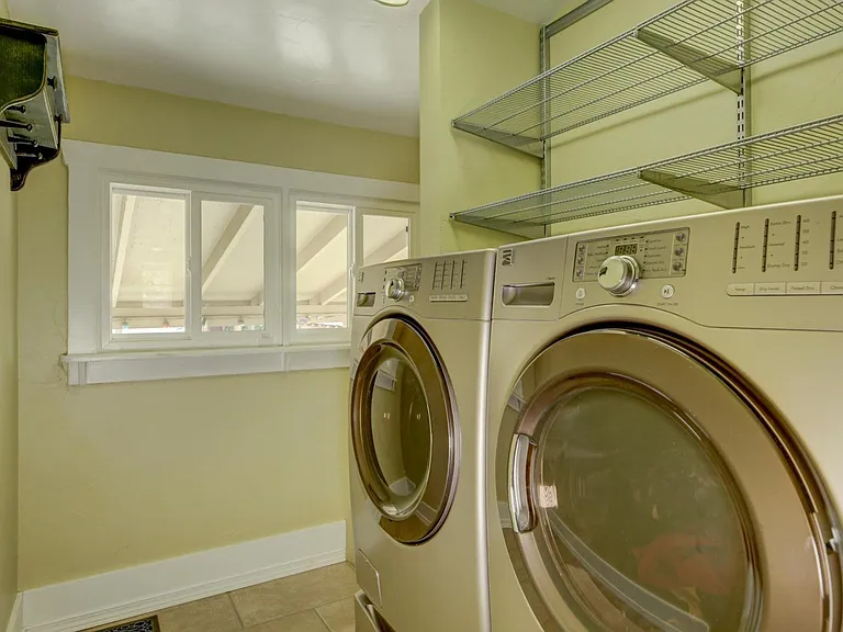Energy Efficient Front Loading Washer & Dryer with Elfa shelving for storage!