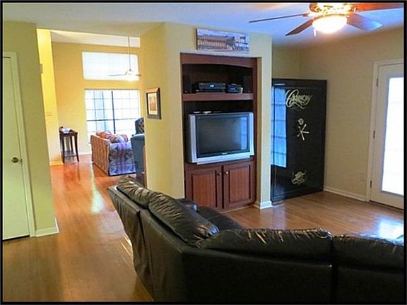 Living room with built in entertainment niche across from he kitchen. Can also be used as a formal dining room.