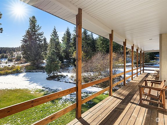 Beautiful areas of lawn nestled within the evergreens.>