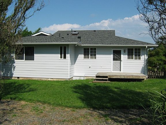 Front of the home showing large covered entry, new hardi-plank siding, new exterior paint and a new roof.