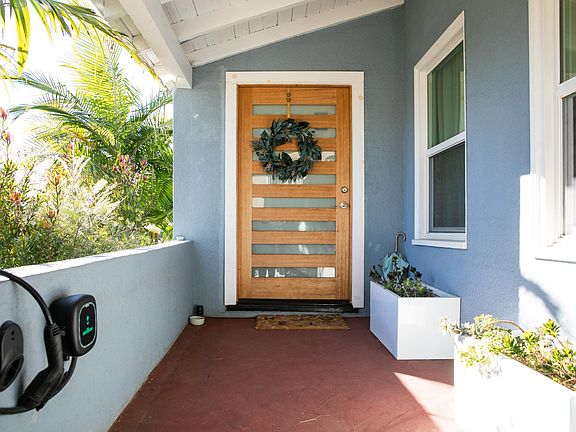 Secure front patio and EV charger accessible from the front driveway.