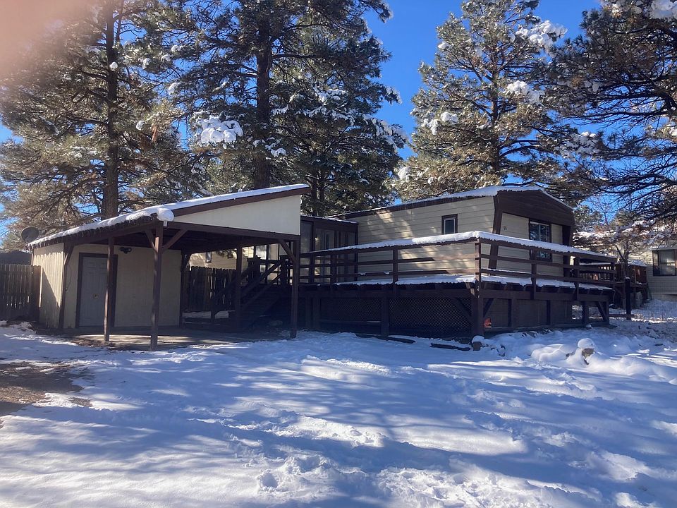 90 Canyon Circle is a 3 bedroom, 1.75 bath with a carport, unattached storage room and a fenced back yard.